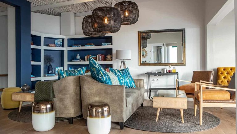 Stylish lounge interior at Villa Marine Guest House in Pringle Bay with ocean-inspired décor and warm lighting